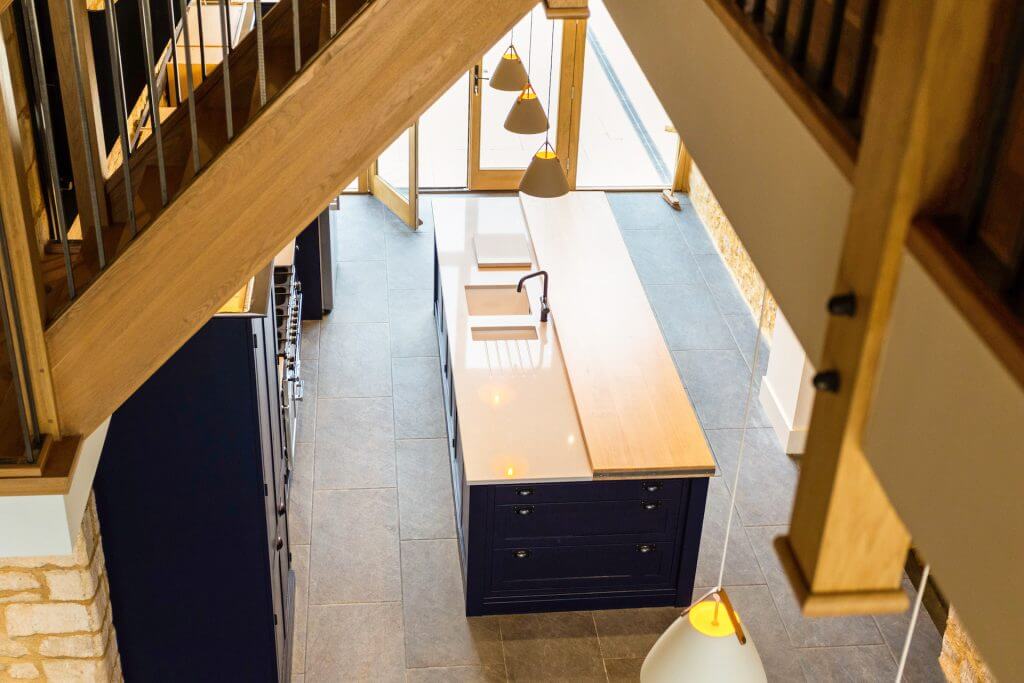 The Tithe Barn Stanley Downton kitchen view looking down from upstairs